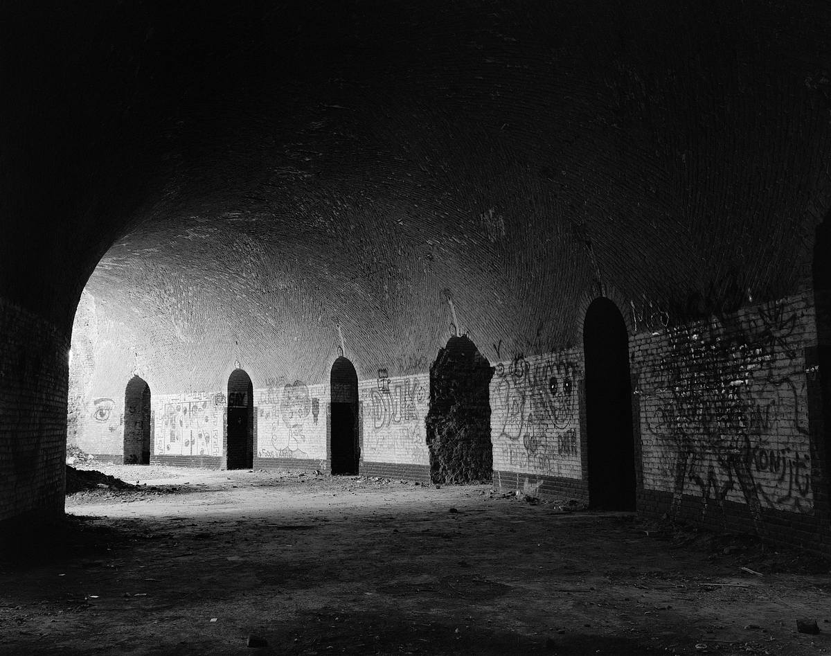 Partially destroyed living quarters of Fort III