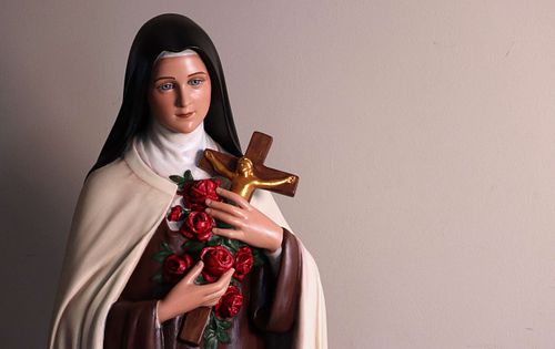 St. Therese statue after restoration by Kelly Baker of Contrasts Woodcarving