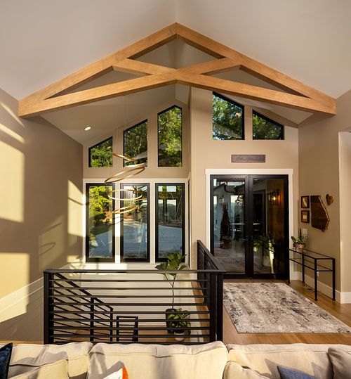 Profile view of wood ceiling truss over stair