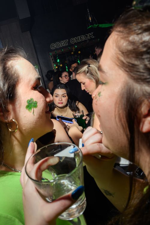event photography at a nightclub in Vancouver with face painting happening in the foreground
