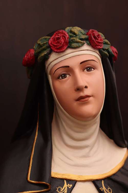 Restored statue of Saint Rose looking straight ahead