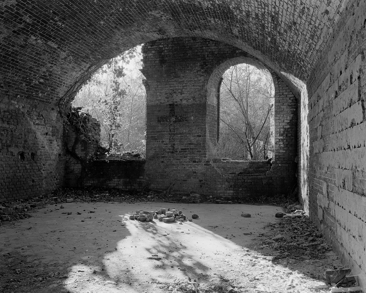 Partially destroyed living quarters at Fort III