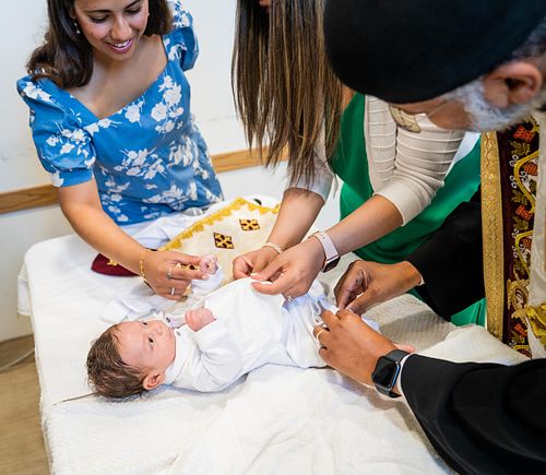 baby baptism ceremony at Ottawa church captured by Kameel Photography