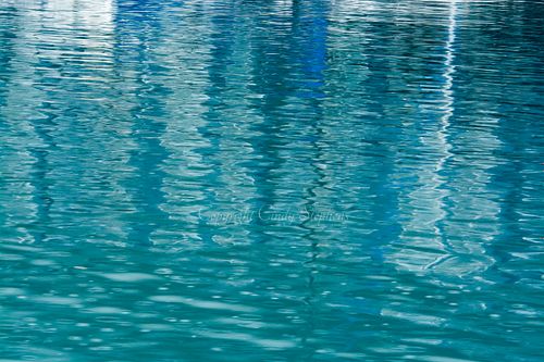 A range of blue hues reflected in water create a soothing scene