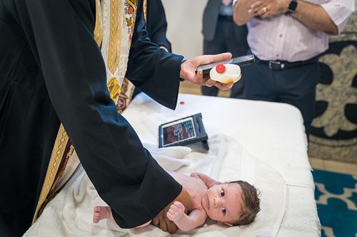 baby baptism ceremony at Ottawa church captured by Kameel Photography