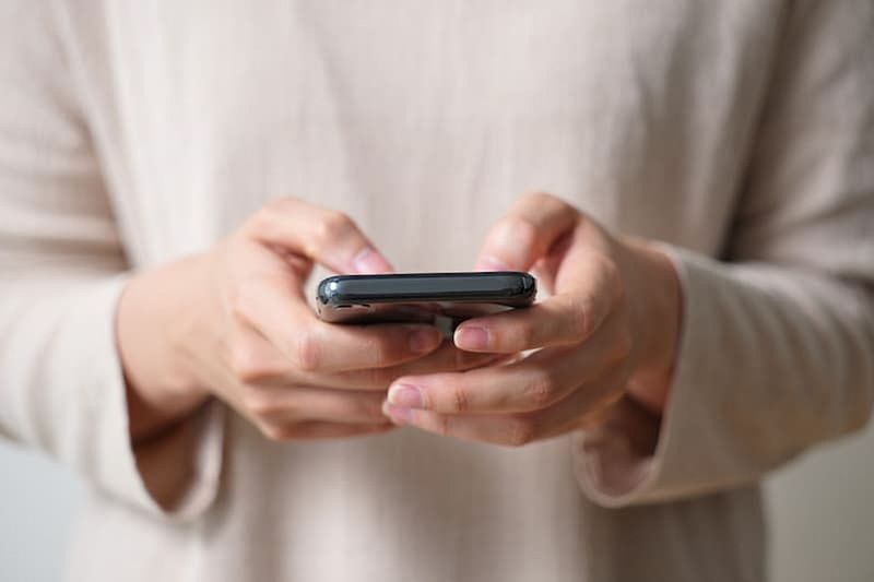 woman searching on her smart phone
