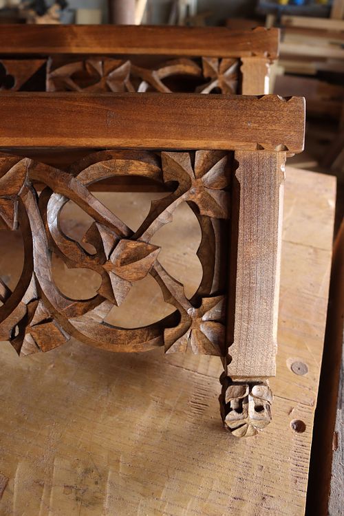 detail picture of the scrolling vines after stain and finish