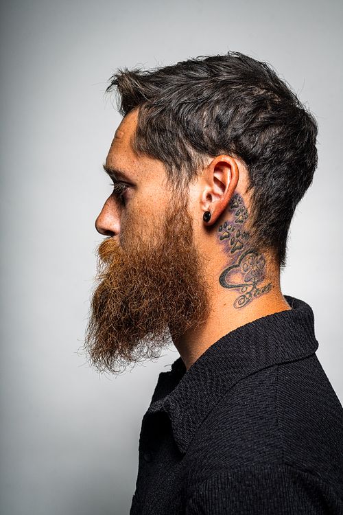 Creative angle studio portrait of Tim with strobes on white background — contemporary portrait by David Andrade, Las Vegas