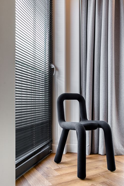 Interior detail featuring a designer chair &ndash; Azoria project