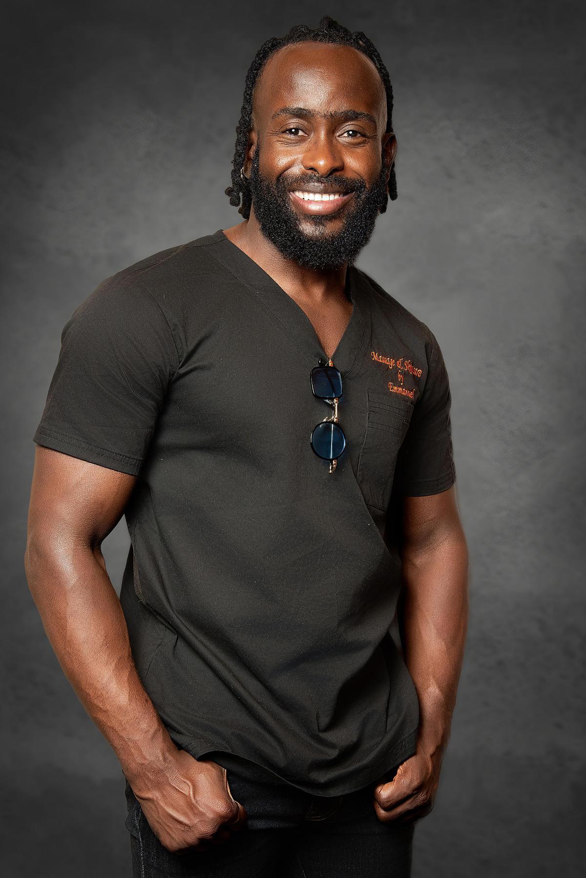 Headshot of a black man who is a massage therapist.