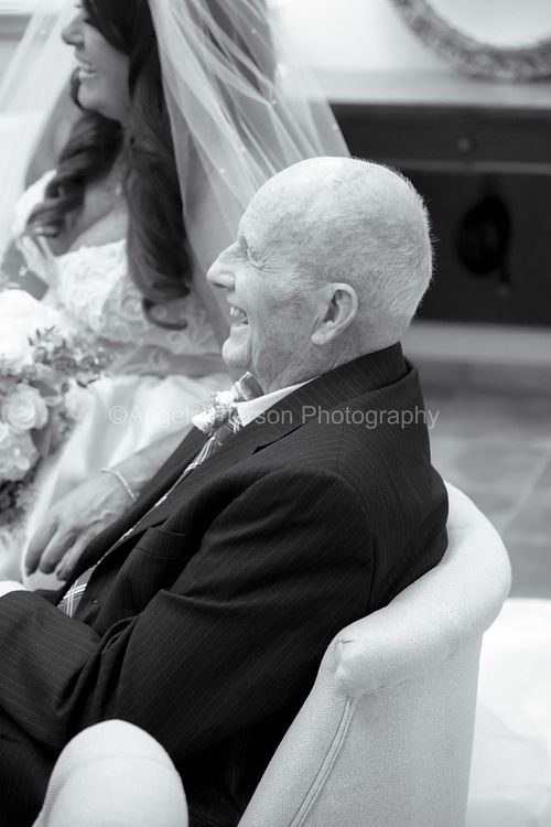 A candid shot of a bride and her dad photographed in black and white