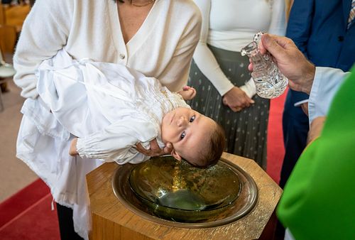Ottawa Catholic baptism photographer capturing emotional moments