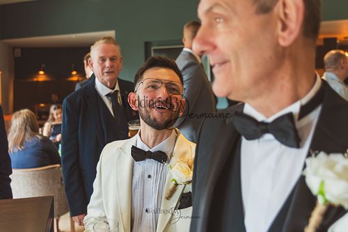 Wedding by Jermaine – groom and father sharing a moment before the wedding ceremony