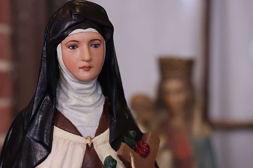 The same, small statue of St. Therese after restoration by Wes and Kelly Baker of Contrasts Woodcarving