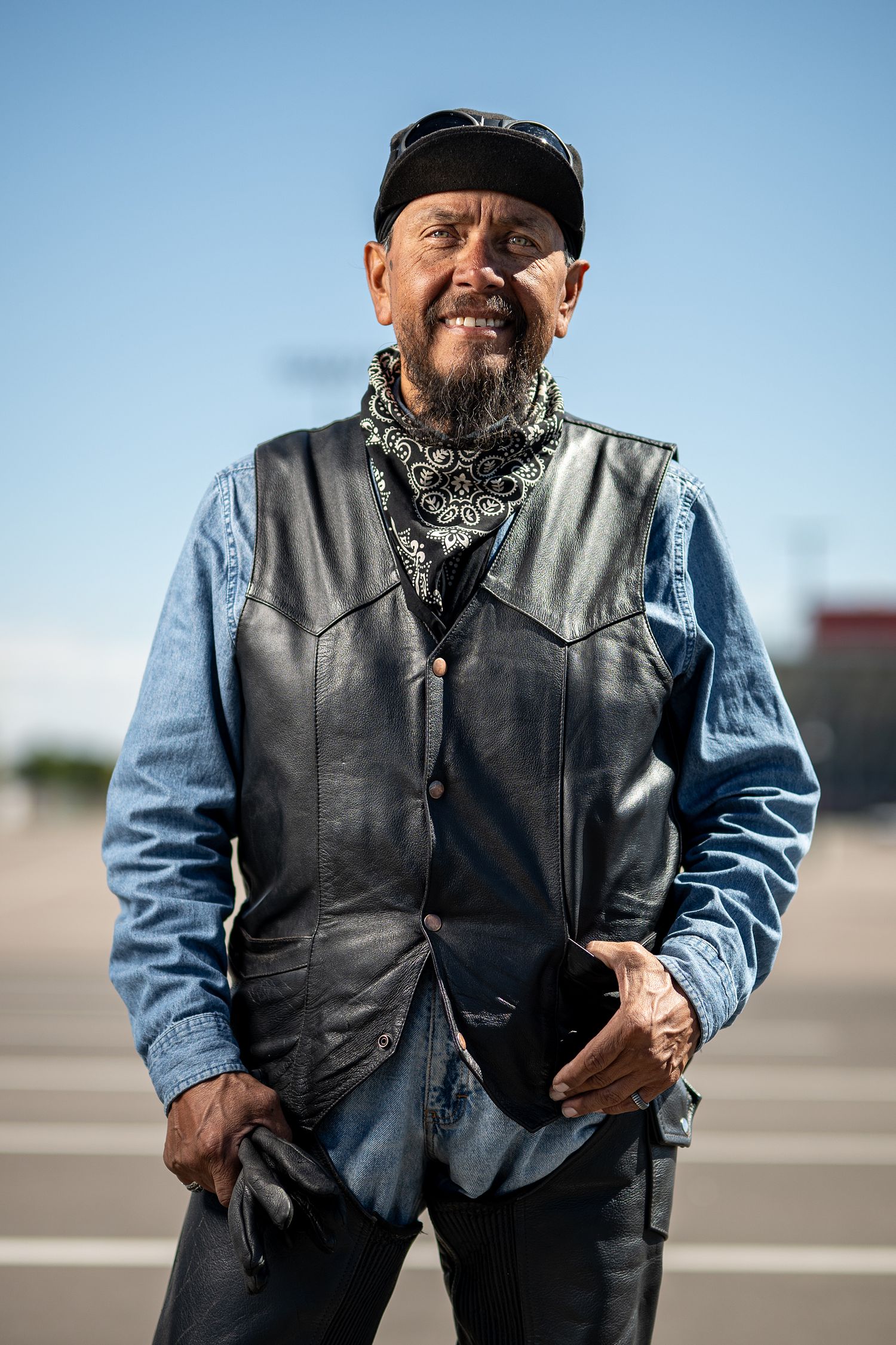Environmental Portrait of man in motorcycle clothes. editorial