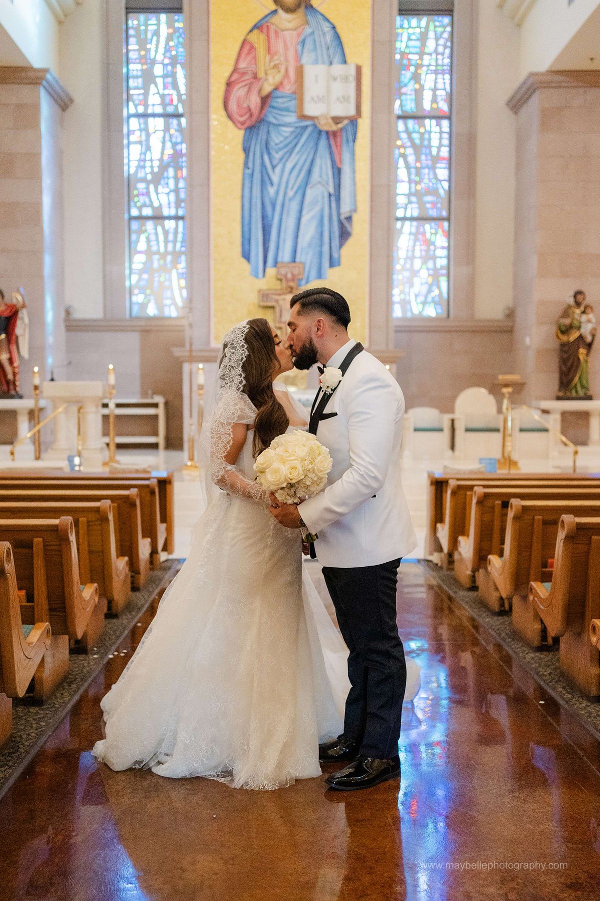 Exchanging vows at Saint Joseph, Husband of Mary Roman Catholic Church in Las Vegas Wedding Photography