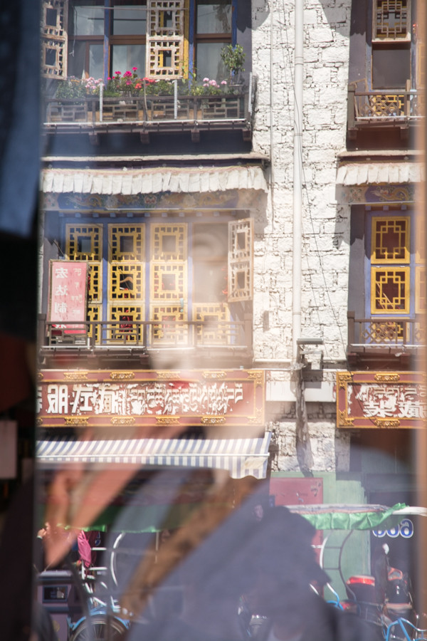 Tibetan building as reflected in window
