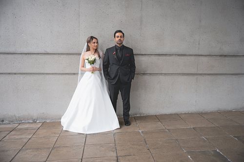 Spring wedding couple walking together in the rain in Vancouver