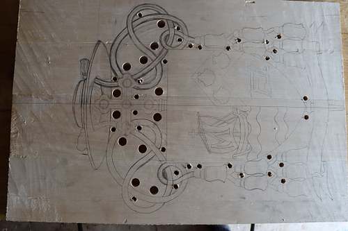 basswood panel full of holes ready for cutting out