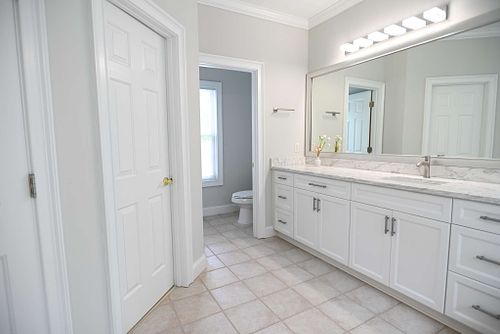 Illuminated bathroom with stained glass,and soaking tub
