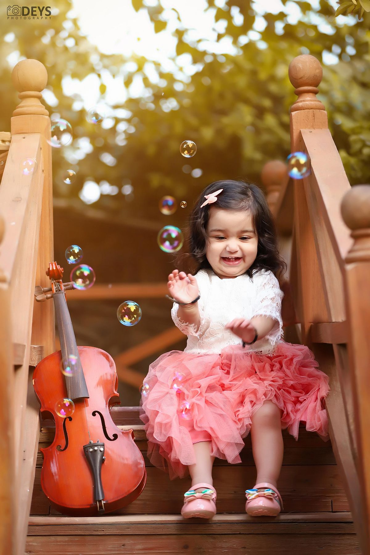 Baby playing with bubbles photoshoot