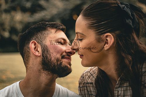 Close-up of Alex and Shelby going in for a kiss during their engagement shoot, captured by Weddings by Jermaine, showcasing their love and affection