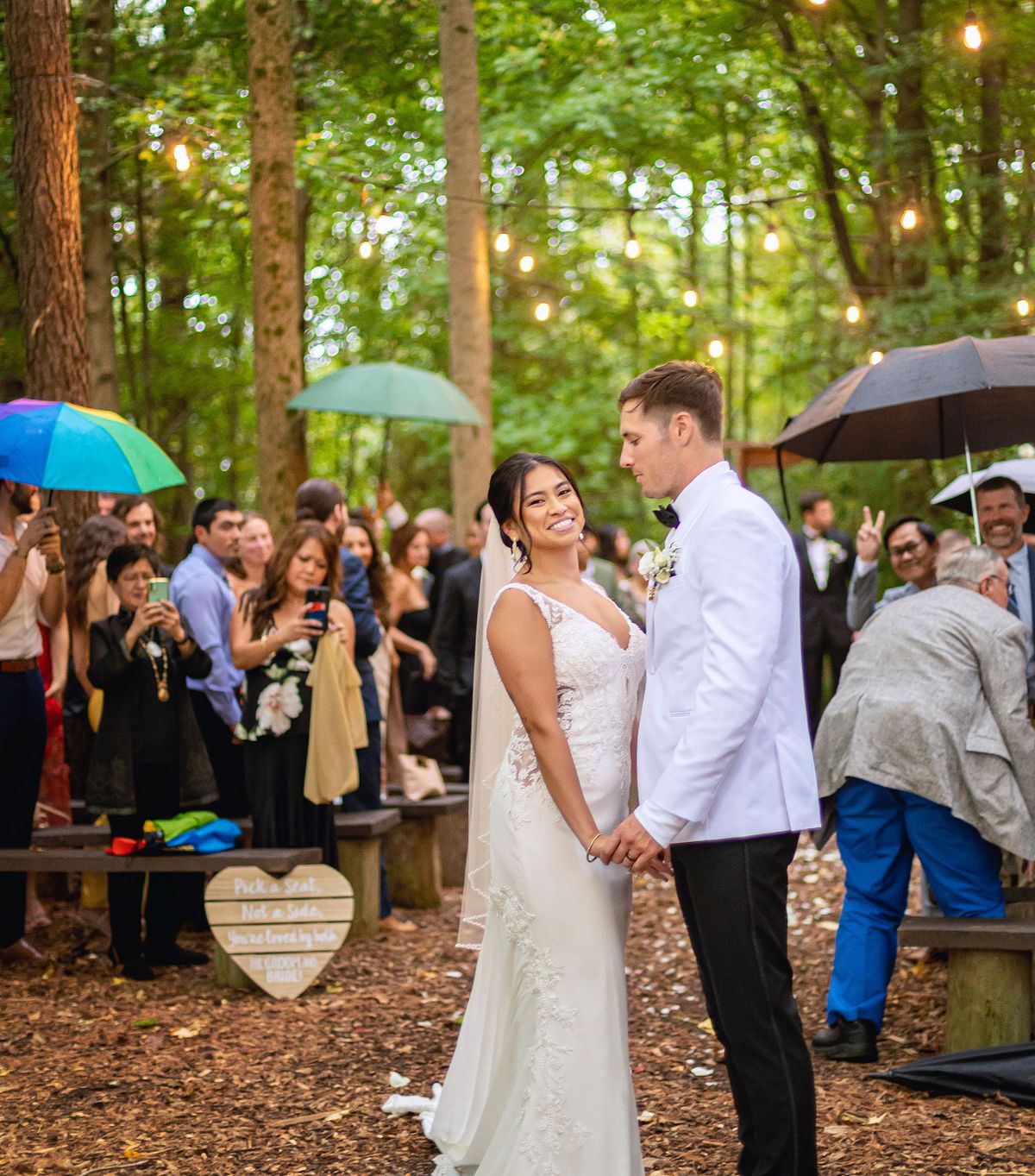 bride and groom holding hands after the ceremony in the woodlands at kylan barn