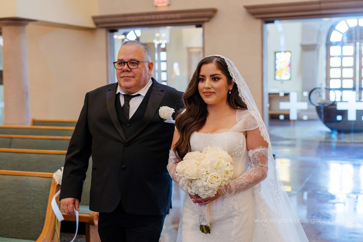 Exchanging vows at Saint Joseph, Husband of Mary Roman Catholic Church in Las Vegas Wedding Photography