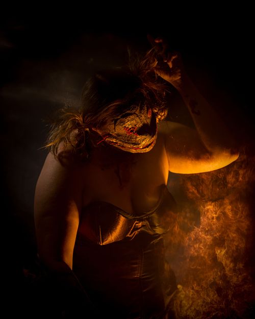 The voodoo doll dancing in the light of a fire.