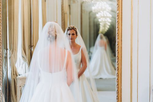 Bride looking in mirror