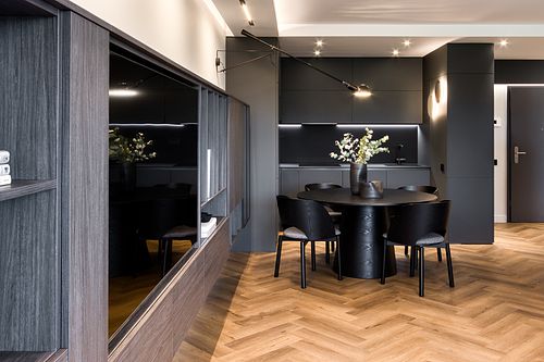 Kitchen and dining area with a dark, moody atmosphere &ndash; Azoria project