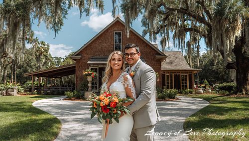 Couple at a North Mid-FL private estate wedding ceremony with a rustic barn by Legacy of Love Photography.