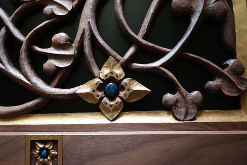hand-carved Virgin's Bower Flower with gold and blue paint
