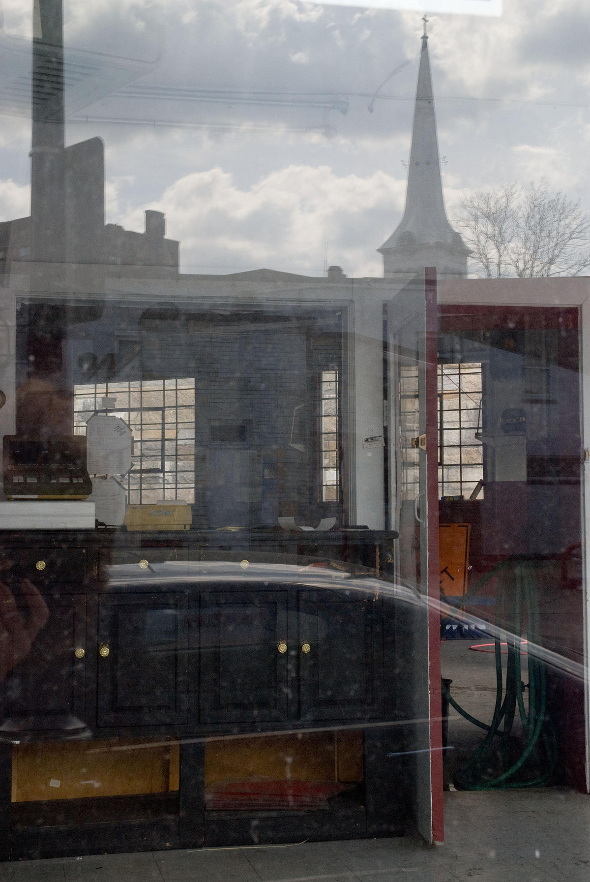 Inside and out reflections at an auto repair store