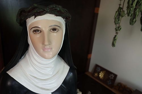 Very Pale face of statue in need of restoration