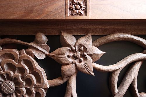 lily carved by hand in walnut by Wes Baker of Contrasts wood carving for a shrine for St. Joseph