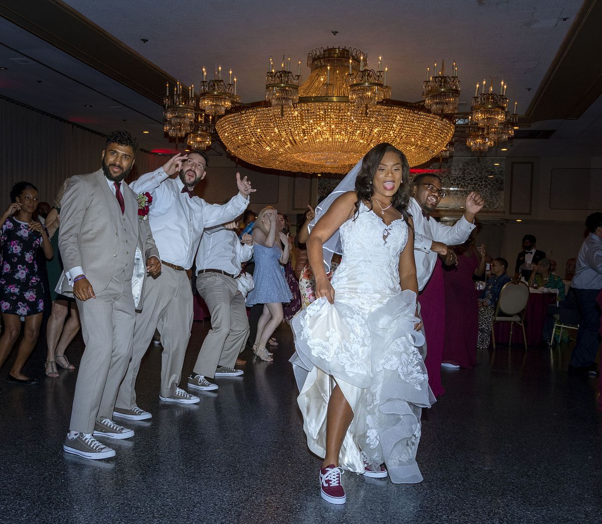 Indoor wedding reception lighting showing casing direct flash during dancing