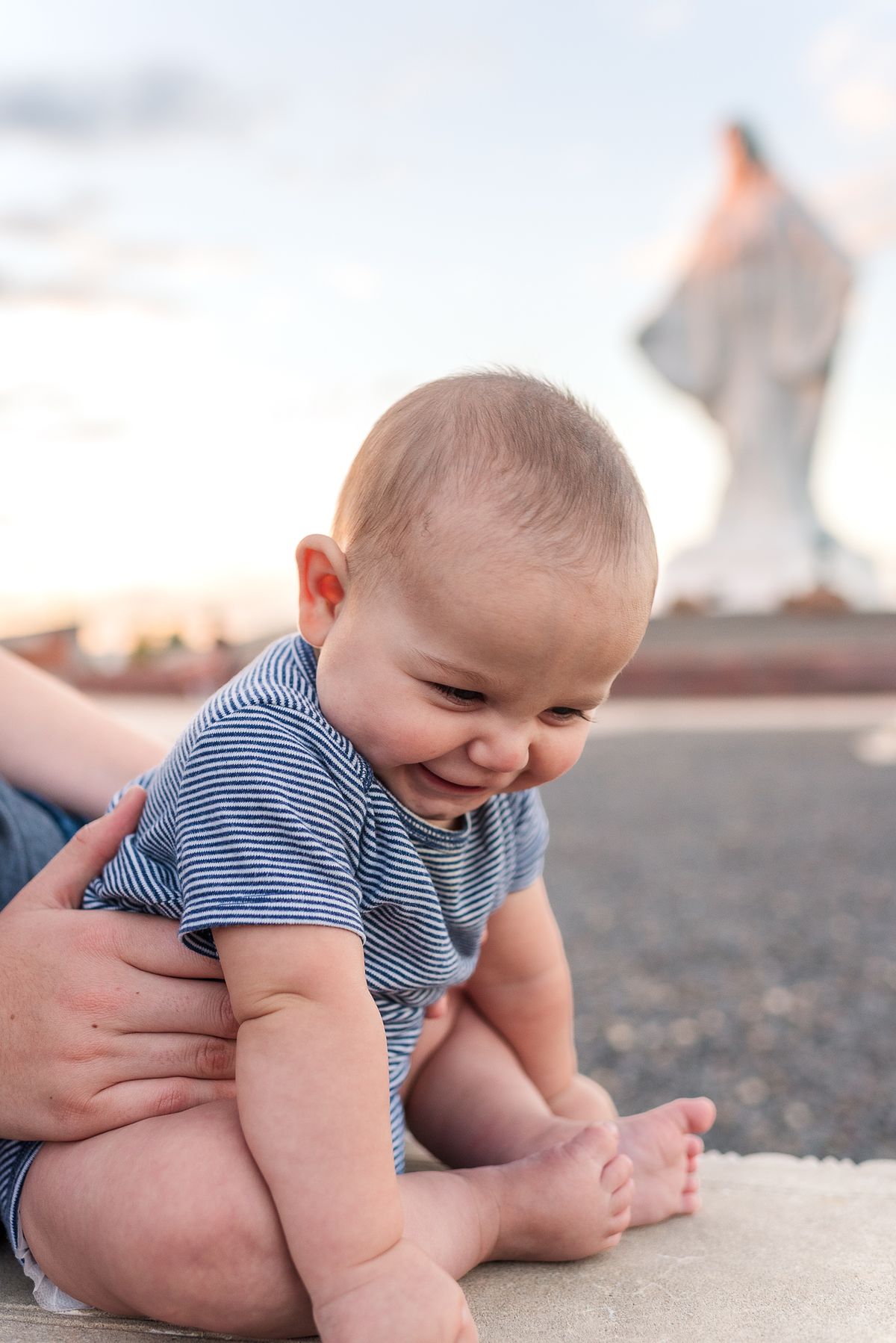 Baby in front of shrine of Mary at Our Lady of Peace in Pine Bluffs, WY