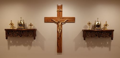 the shelves with the reliquaries on them flanking the crucifix at the back of the chapel