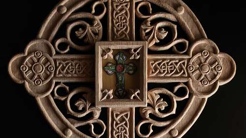 Close up picture of the carving on the reliquary and the relic itself.