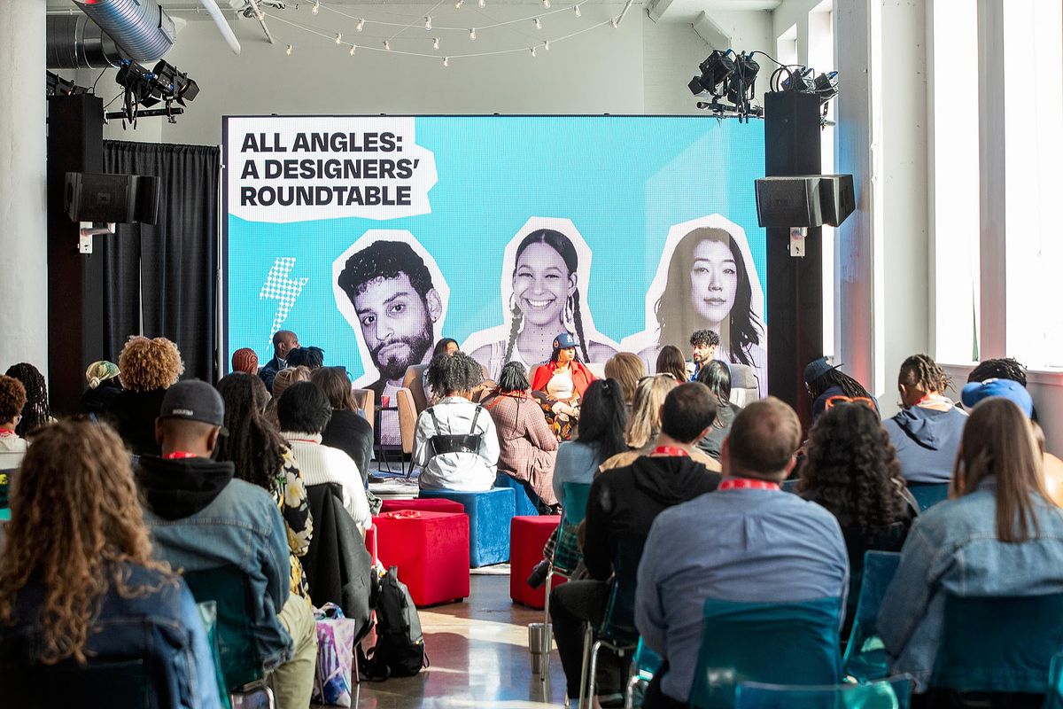 Corporate event photography capturing creative leaders speaking during the &ldquo;All Angles: A Designers&rsquo; Roundtable&rdquo; session at B.PHL Fest 2023 in Philadelphia, highlighting innovation, storytelling, and collaborative dialogue in design.