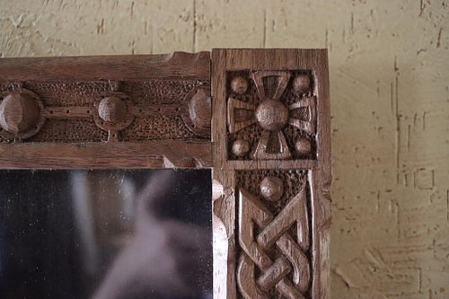 close up image of the roundel carving in walnut