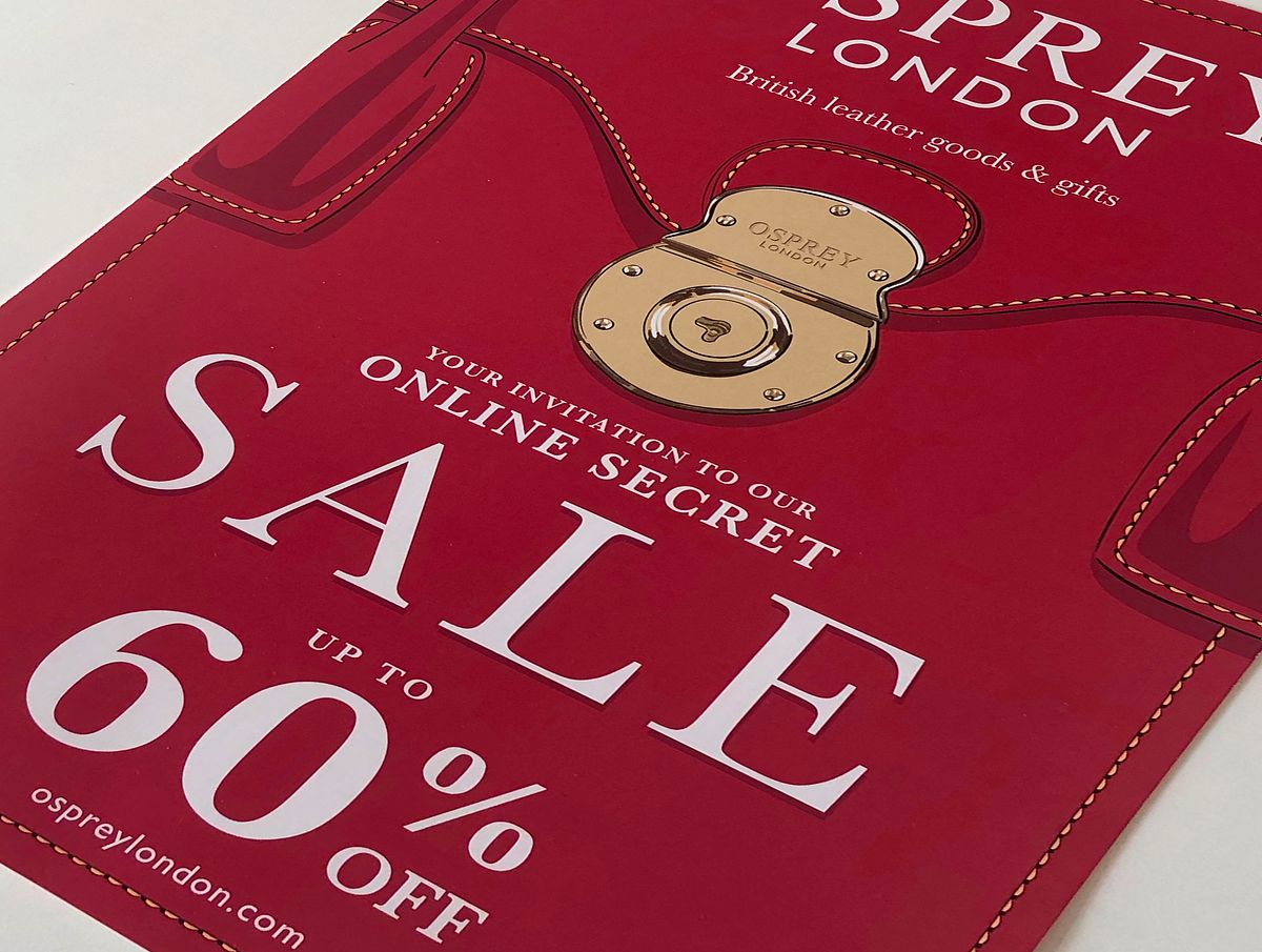 illustration of gold clasp on a red satchel with the words SALE 60% off